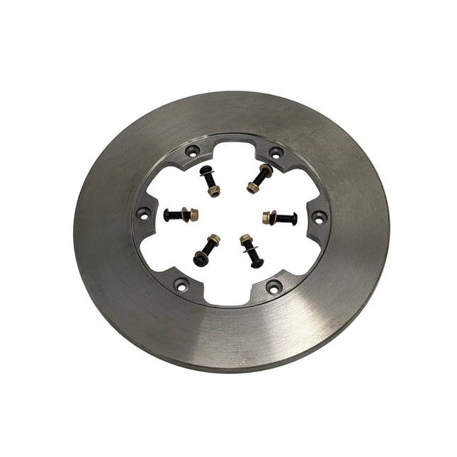 Metallic brake rotor with nuts and bolts on a white background