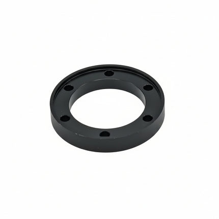 Black mechanical component on a white background