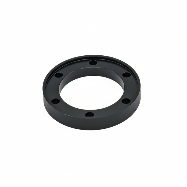 Black mechanical component on a white background