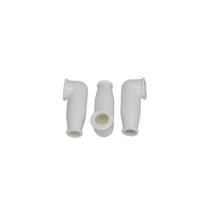 Three white plastic connectors on a gray background
