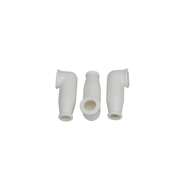 Three white plastic connectors on a gray background
