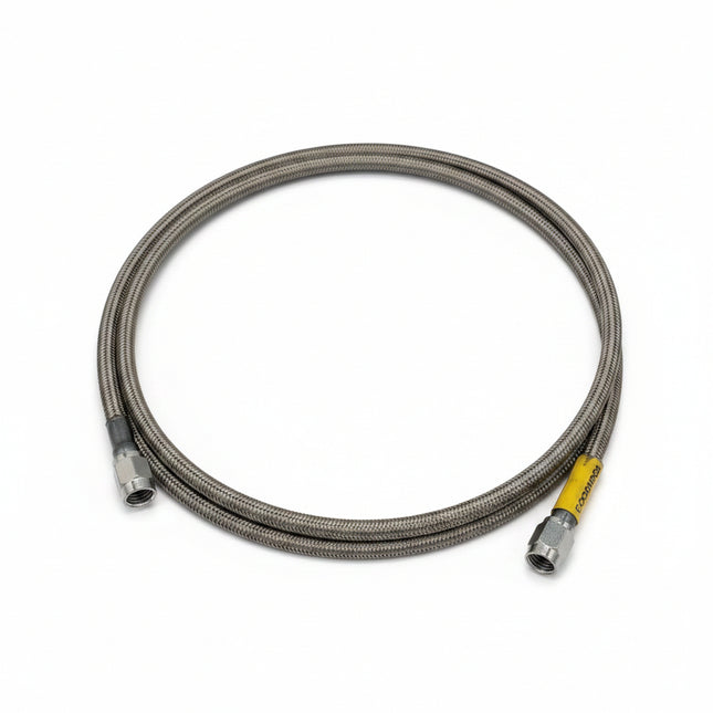 Metal cable with a yellow end on a white background