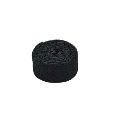 Black roll of Velcro on a white background
